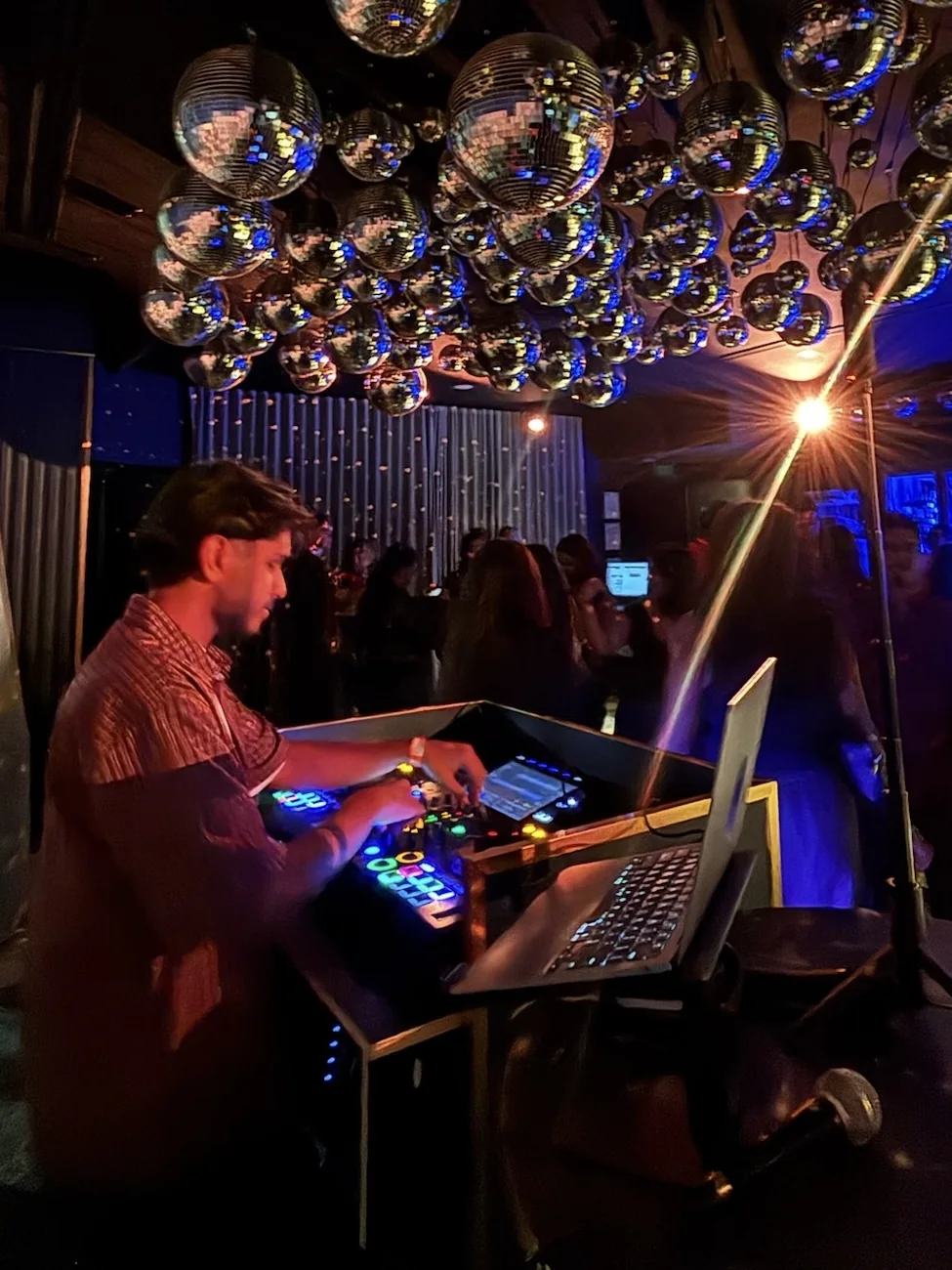DJ Bhargav performing at a disco ball venue in Melbourne