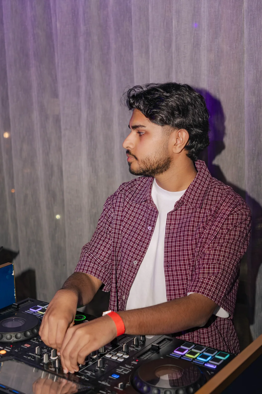 Editorial portrait of DJ Bhargav at the decks